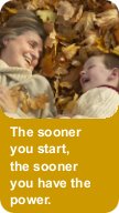 Grandmother and grandson in a pile of leaves - The sooner you start, the sooner you have the power
