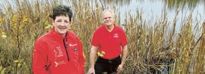 Two Scotiabank employees in a wetland