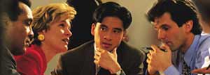 Four people at a business meeting