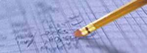 A pencil erasing a journal entry.