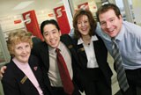 Four Scotiabank employees in a branch