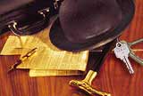 Image of hat, briefcase, papers and keys