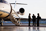 People gathered on a tarmac.