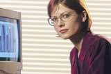 A woman sitting at a computer.