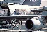 An airplane loading cargo.