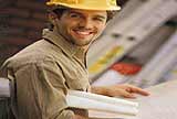 A man reading blueprints.