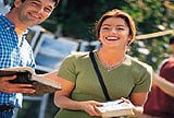 Happy people carrying books