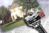 image of key on a photo of a house