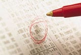 circled stock price in newspaper