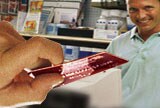 ScotiaCard being handed to a merchant