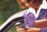 woman with cell phone on the move