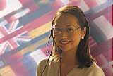Woman with headset in front of world flags