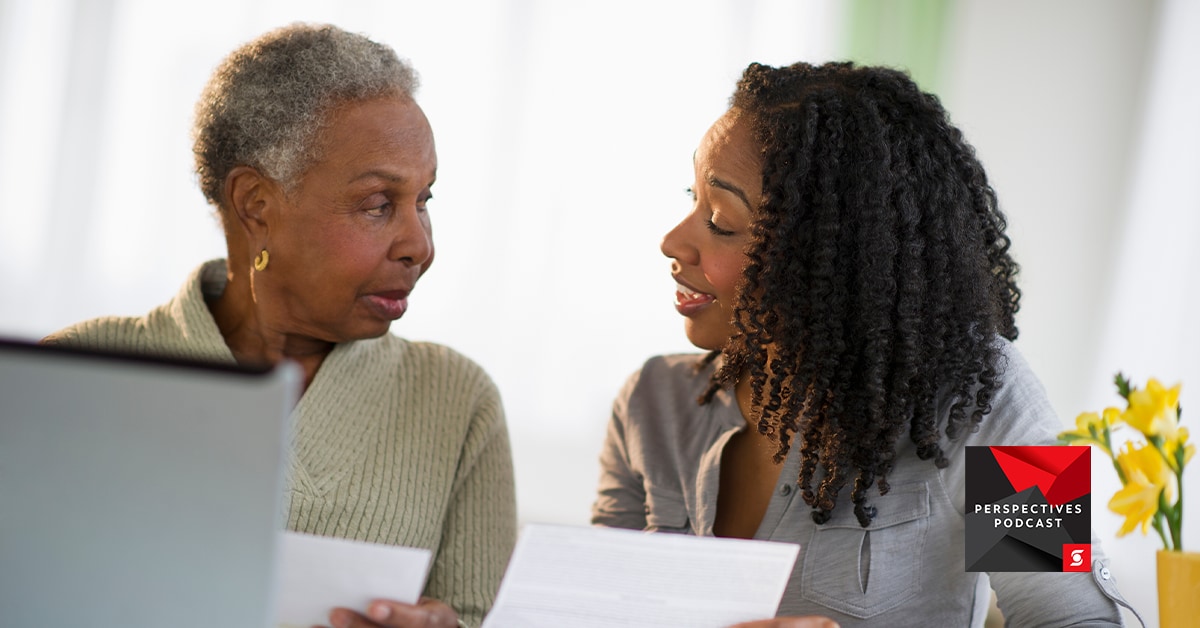 Mother and daughter speaking about document