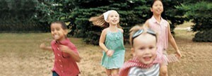 Kids running across field